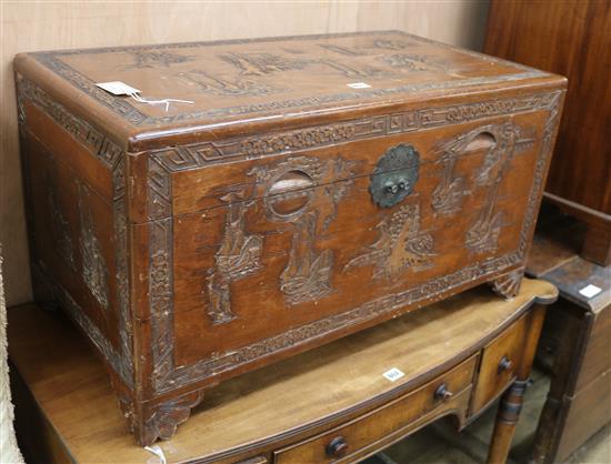 A carved camphorwood chest W.84cm